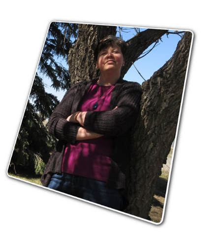 Grace casually leans against an ash tree.